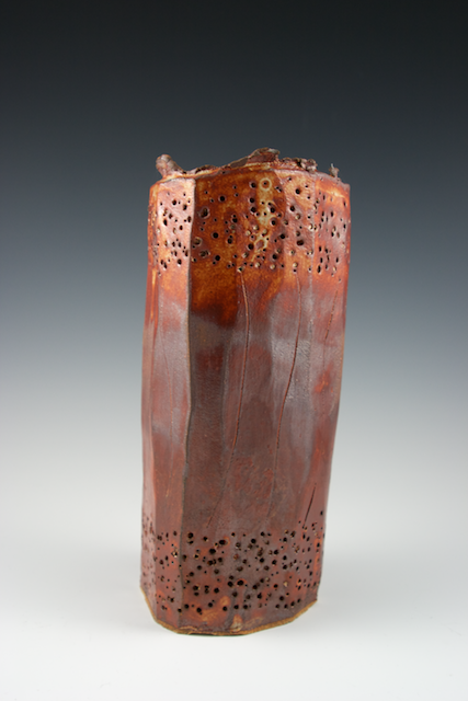 Tall, perforated vessel